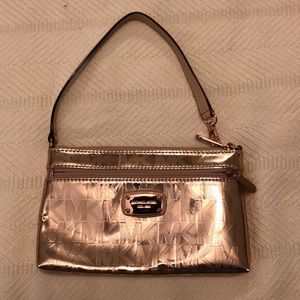 Michael Kors shiny rose gold wristlet